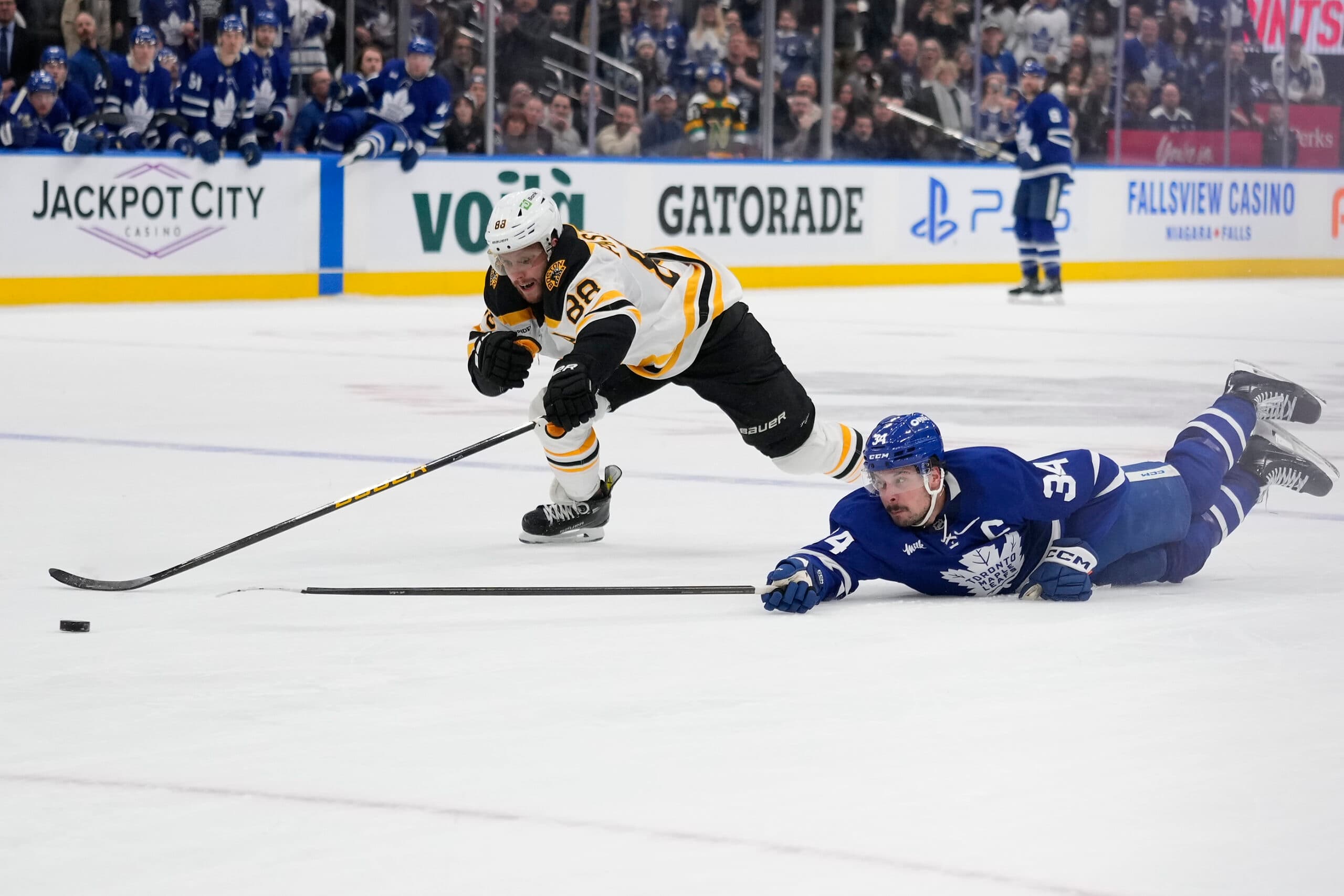 Auston Matthews of the Maple Leafs and David Pastranak of the Bruins.